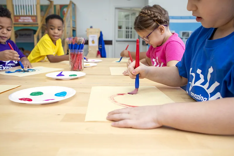Children in a STEAM classroom at an Amazing Explorers Academy