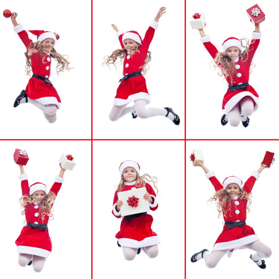 Happy girl with santa costume jumping