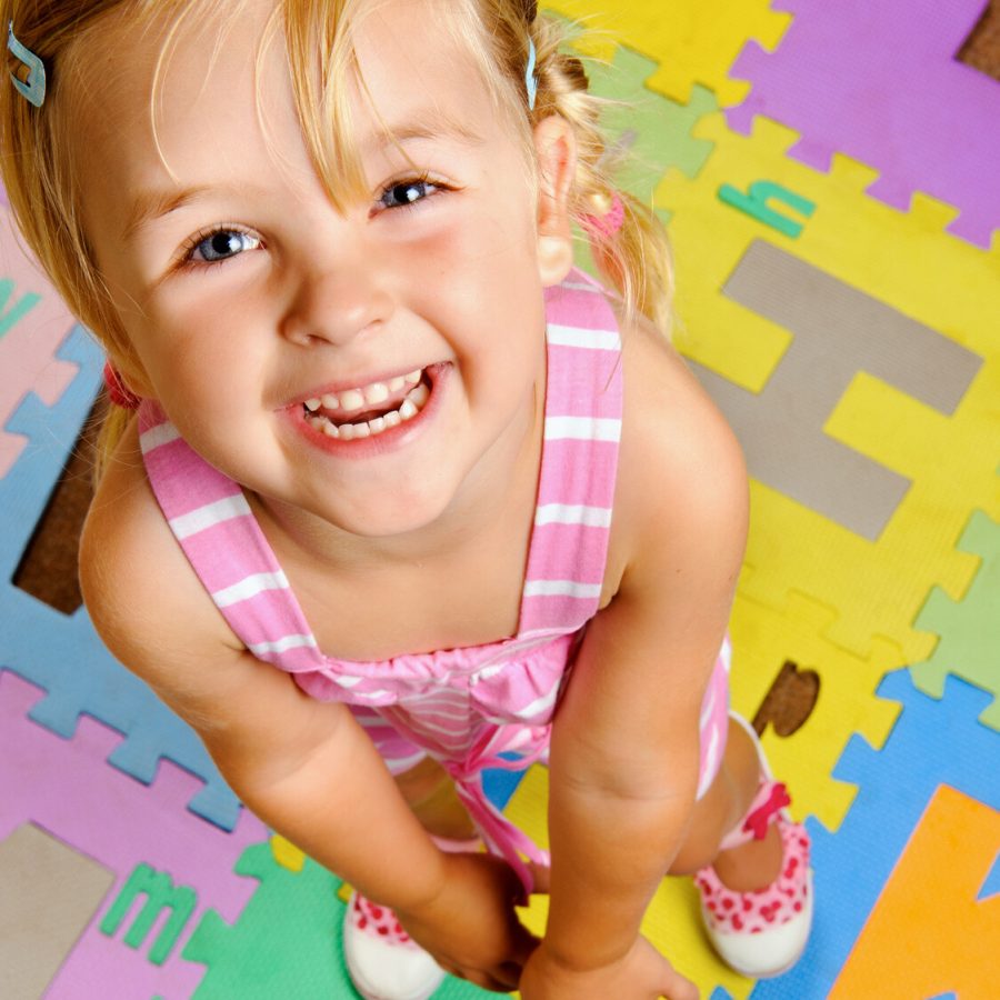 child learning the alphabet is happy